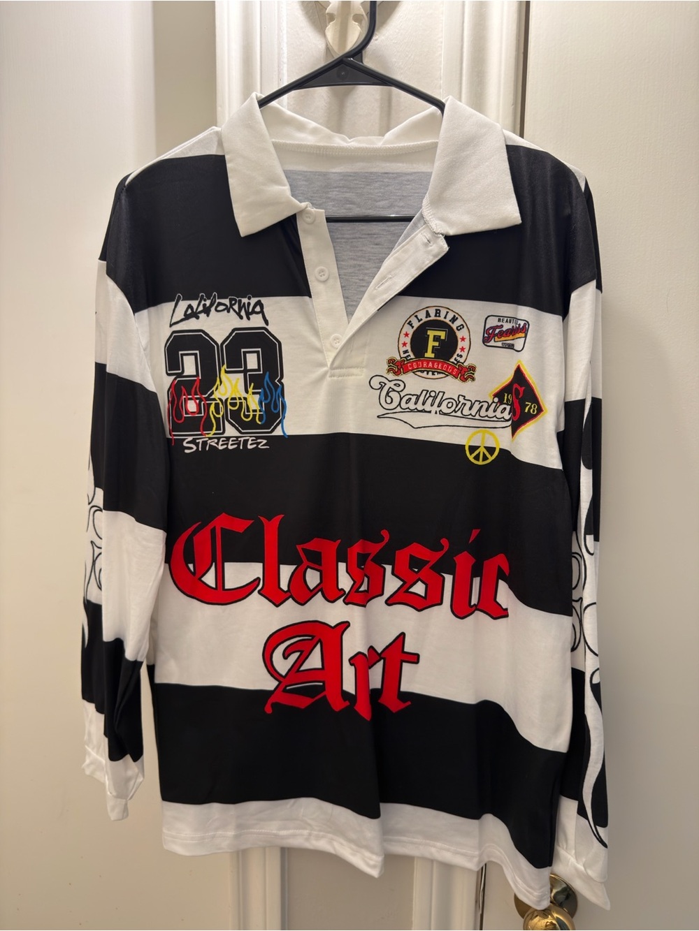 Classic Art Black & White Striped Rugby Shirt with Red Lettering